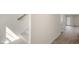 Carpeted stairway with a light-filled hallway, leading to a door with backyard access and modern flooring at 521 Fife Ct, Gibsonville, NC 27249