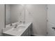 Bathroom with double sinks, modern fixtures, and granite countertops at 523 Fife Ct, Gibsonville, NC 27249