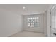 Bedroom with plush carpet, neutral walls, and a window offering natural light at 523 Fife Ct, Gibsonville, NC 27249