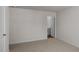 A light-filled bedroom features neutral carpet and fresh white walls at 523 Fife Ct, Gibsonville, NC 27249