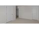 Carpeted bedroom with neutral walls, multiple doors, and ample closet space at 523 Fife Ct, Gibsonville, NC 27249