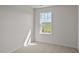 A bright bedroom with a large window overlooking a green field at 523 Fife Ct, Gibsonville, NC 27249