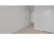 Hallway view with neutral carpet and white doors at 523 Fife Ct, Gibsonville, NC 27249