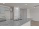 Bright kitchen with granite countertop, stainless sink, and modern gray cabinetry at 523 Fife Ct, Gibsonville, NC 27249