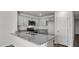 Well-equipped kitchen with sleek gray cabinetry, granite counters, and stainless appliances at 523 Fife Ct, Gibsonville, NC 27249