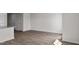 Spacious open-concept living room with wood-look floors and ample natural light at 523 Fife Ct, Gibsonville, NC 27249