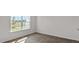 Bright room with light hardwood flooring, fresh paint, and a large, scenic window at 523 Fife Ct, Gibsonville, NC 27249