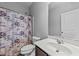 Clean bathroom featuring a vanity, mirror, and shower with a stylish curtain at 629 Kenyon Spring Dr, Zebulon, NC 27597