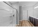 Bright bathroom with glass door shower and vanity at 629 Kenyon Spring Dr, Zebulon, NC 27597