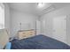 Bright bedroom with hardwood floors and a mirror at 629 Kenyon Spring Dr, Zebulon, NC 27597