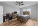 Well-lit bedroom featuring modern furniture, hardwood floors, and plenty of natural light at 629 Kenyon Spring Dr, Zebulon, NC 27597