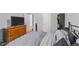 Bedroom with hardwood floors, gray walls, and a walk-in closet at 629 Kenyon Spring Dr, Zebulon, NC 27597