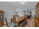 Dining room and kitchen combination with wood table set and stainless steel appliances at 629 Kenyon Spring Dr, Zebulon, NC 27597