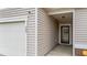 Close up of home's entrance showing attached garage and front door entryway at 629 Kenyon Spring Dr, Zebulon, NC 27597