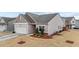 Inviting single-Gathering home with a manicured front yard and attached two-car garage at 629 Kenyon Spring Dr, Zebulon, NC 27597