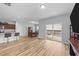 Bright and open floor plan with hardwood flooring connecting the kitchen, dining and living areas at 629 Kenyon Spring Dr, Zebulon, NC 27597