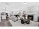 Open-concept living room and kitchen with modern decor and a fireplace at 637 Emerald Bay Cir, Raleigh, NC 27610