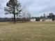 Picture of the spacious backyard that features a clear view of the forest line in the distance at 76 Mangrove Ct, Four Oaks, NC 27524