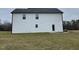 Back of the home with a set of doors leading to the spacious backyard at 76 Mangrove Ct, Four Oaks, NC 27524