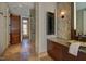 Stylish bathroom with a glass door shower, vanity, and tiled accent wall at 805 Greenwood Rd, Chapel Hill, NC 27514