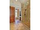 Modern bathroom with a glass shower, mosaic tile, and travertine floor at 805 Greenwood Rd, Chapel Hill, NC 27514