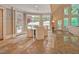 Sunlit breakfast nook with a round table, bay windows, and travertine flooring at 805 Greenwood Rd, Chapel Hill, NC 27514