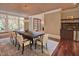 Spacious dining room boasts a large table, custom light fixture and a convenient wet bar at 805 Greenwood Rd, Chapel Hill, NC 27514