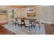 Elegant dining area showcasing a substantial table, art and a decorative lighting fixture at 805 Greenwood Rd, Chapel Hill, NC 27514