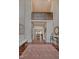 Grand foyer with high ceilings, dark wood floors, area rug and ornate iron balcony overlooking the living area at 805 Greenwood Rd, Chapel Hill, NC 27514