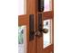 Stunning front door featuring a smart lock system, and beautiful handle fixtures on a charming wood frame at 805 Greenwood Rd, Chapel Hill, NC 27514