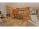 Open concept kitchen featuring stone accents, an island with seating, and stainless steel appliances at 805 Greenwood Rd, Chapel Hill, NC 27514