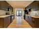 Modern kitchen with sleek, dark cabinetry, stainless appliances, and open layout at 805 Greenwood Rd, Chapel Hill, NC 27514