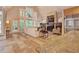 Bright living room with a stone fireplace, large windows, and an open floor plan at 805 Greenwood Rd, Chapel Hill, NC 27514