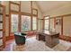 Well-lit office with large windows, custom trim, vaulted ceilings, and vintage wooden desk at 805 Greenwood Rd, Chapel Hill, NC 27514