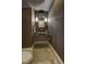 Cozy powder room with a glass vessel sink, mosaic tile, and wood-look wall coverings at 805 Greenwood Rd, Chapel Hill, NC 27514