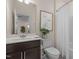 Bathroom with shower-tub, vanity, toilet, and decor create a stylish and comfortable space at 917 Matterhorn Dr, Fuquay Varina, NC 27526