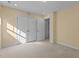 Bedroom with large closet, plush carpeting, and overhead lighting offers comfort at 917 Matterhorn Dr, Fuquay Varina, NC 27526