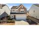 Charming two-story home with a two-car garage, well-kept lawn, and a cozy covered entryway at 917 Matterhorn Dr, Fuquay Varina, NC 27526