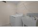 Functional laundry room with a utility sink, washer, and dryer for convenient chores at 917 Matterhorn Dr, Fuquay Varina, NC 27526