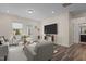 Comfortable living room featuring neutral decor, hardwood floors, and ample natural light at 917 Matterhorn Dr, Fuquay Varina, NC 27526