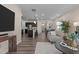 Open-concept living room with hardwood floors, flowing into kitchen and dining area at 917 Matterhorn Dr, Fuquay Varina, NC 27526