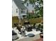 Backyard patio featuring an outdoor kitchen, seating, and grill at 917 Widewaters Pkwy, Knightdale, NC 27545