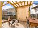 Backyard patio area with seating, fire pit, and privacy screen at 917 Widewaters Pkwy, Knightdale, NC 27545