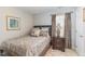 Comfortable bedroom with patterned bedding and a bedside table at 917 Widewaters Pkwy, Knightdale, NC 27545