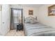Cozy bedroom featuring a comfortable bed, soft lighting, and elegant window coverings at 917 Widewaters Pkwy, Knightdale, NC 27545