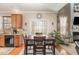 Dining area near the kitchen features a wood table, chairs, and view of the living space at 917 Widewaters Pkwy, Knightdale, NC 27545