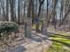 Wrought iron neighborhood entrance gate with brick columns and lush surrounding greenery at 917 Widewaters Pkwy, Knightdale, NC 27545