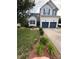 Well-maintained home with a manicured lawn, two-car garage, and attractive landscaping in a suburban setting at 917 Widewaters Pkwy, Knightdale, NC 27545