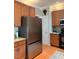 Updated kitchen with stainless steel appliances and wood cabinets at 917 Widewaters Pkwy, Knightdale, NC 27545