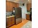 Spacious kitchen with stainless steel refrigerator and ample cabinet space at 917 Widewaters Pkwy, Knightdale, NC 27545